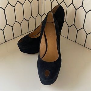 Black suede platform shoes with peephole toe from Aldo.